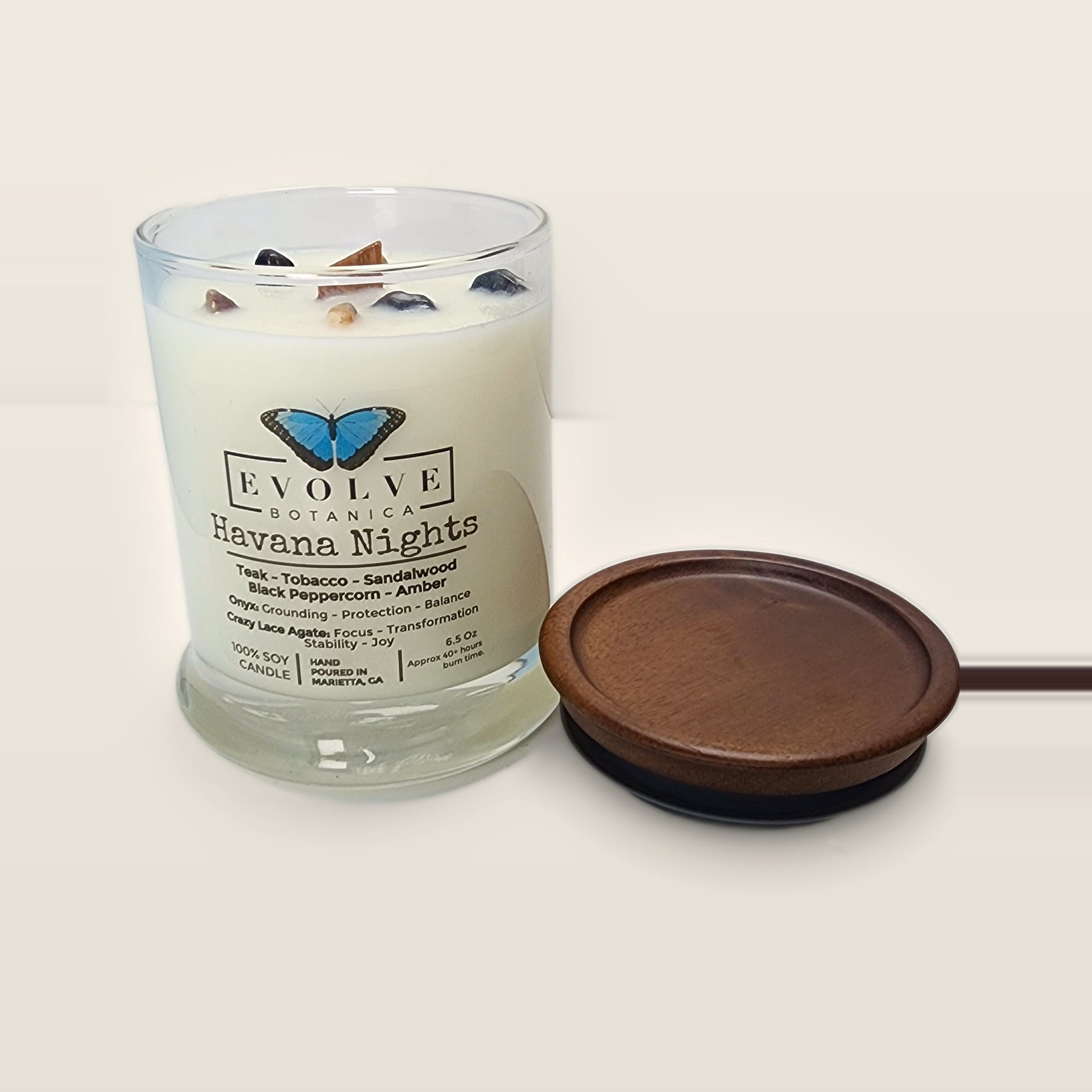 Evolve Botanica Havana Nights 6.5 oz soy sipper candle open with wood lid and crystals