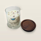 Evolve Botanica Sweet Magnolia 6.5 oz soy sipper candle angled view with wood wick and crystals