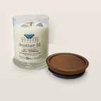 Evolve Botanica Another 33 6.5 oz soy sipper candle open with wood lid and crystals
