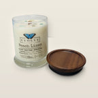 Evolve Botanica Beach Linen 6.5 oz soy sipper candle angled view with wood wick and crystals