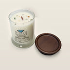 Evolve Botanica Bergamot & Blossoms 6.5 oz soy sipper candle angled view with wood wick and crystals