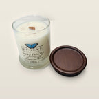 Evolve Botanica Berry Vanilla 6.5 oz soy sipper candle angled view with wood wick and crystals
