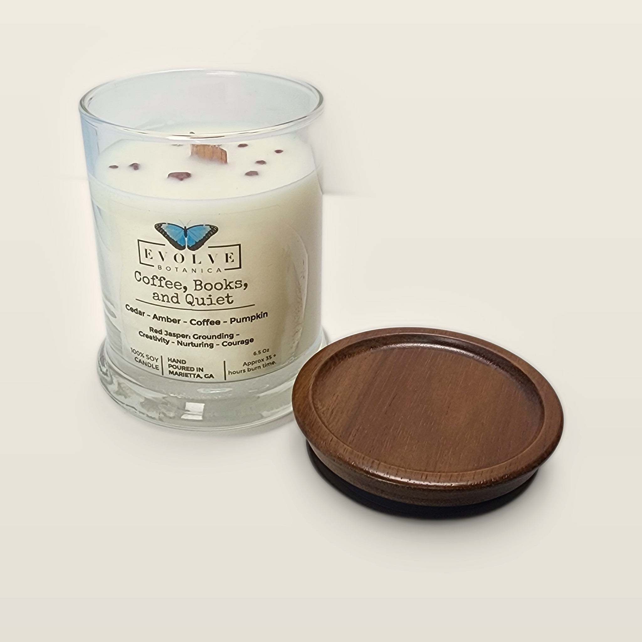 Evolve Botanica Coffee, Books, & Quiet 6.5 oz soy sipper candle open with wood lid and crystals