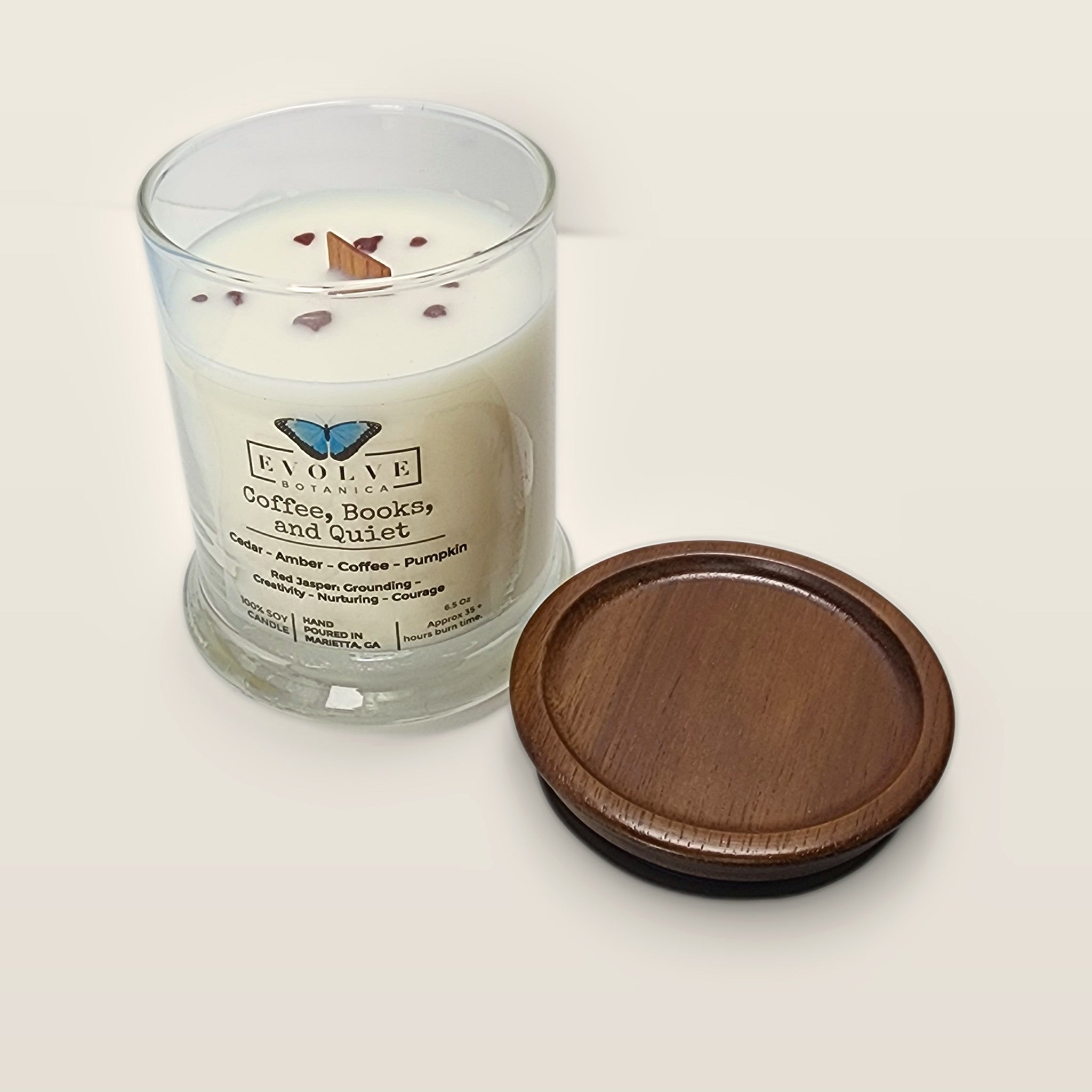 Evolve Botanica Coffee, Books, & Quiet 6.5 oz soy sipper candle angled view with wood wick and crystals