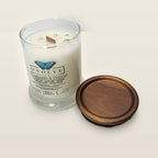 Evolve Botanica Diamonds & Pearls 6.5 oz soy sipper candle angled view with wood wick and crystals