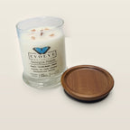 Evolve Botanica Georgia Peach 6.5 oz soy sipper candle open with wood lid and crystals