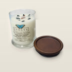 Evolve Botanica Go Touch Grass 6.5 oz soy sipper candle open with wood lid and crystals