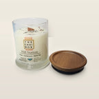 Evolve Botanica Hill Station 6.5 oz soy sipper candle open with wood lid and crystals