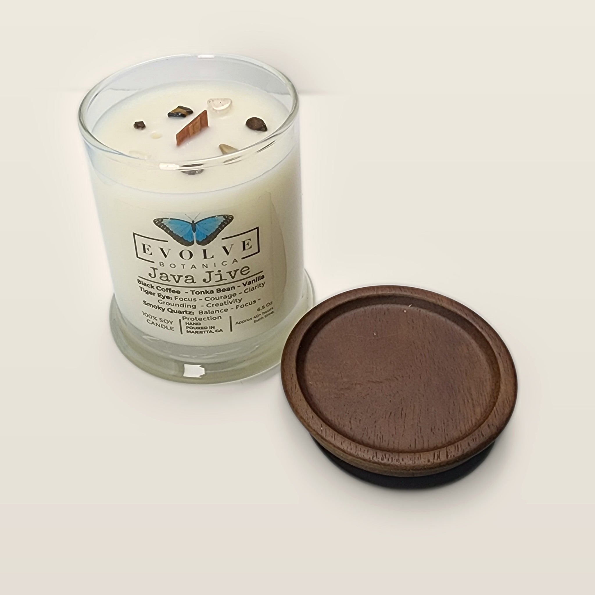 Evolve Botanica Java Jive 6.5 oz soy sipper candle angled view with wood wick and crystals