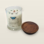 Evolve Botanica Lake House Hideaway 6.5 oz soy sipper candle open with wood lid and crystals