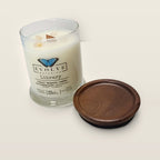 Evolve Botanica Library 6.5 oz soy sipper candle open with wood lid and crystals