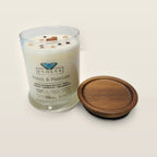 Evolve Botanica Peach & Passion 6.5 oz soy sipper candle open with wood lid and crystals