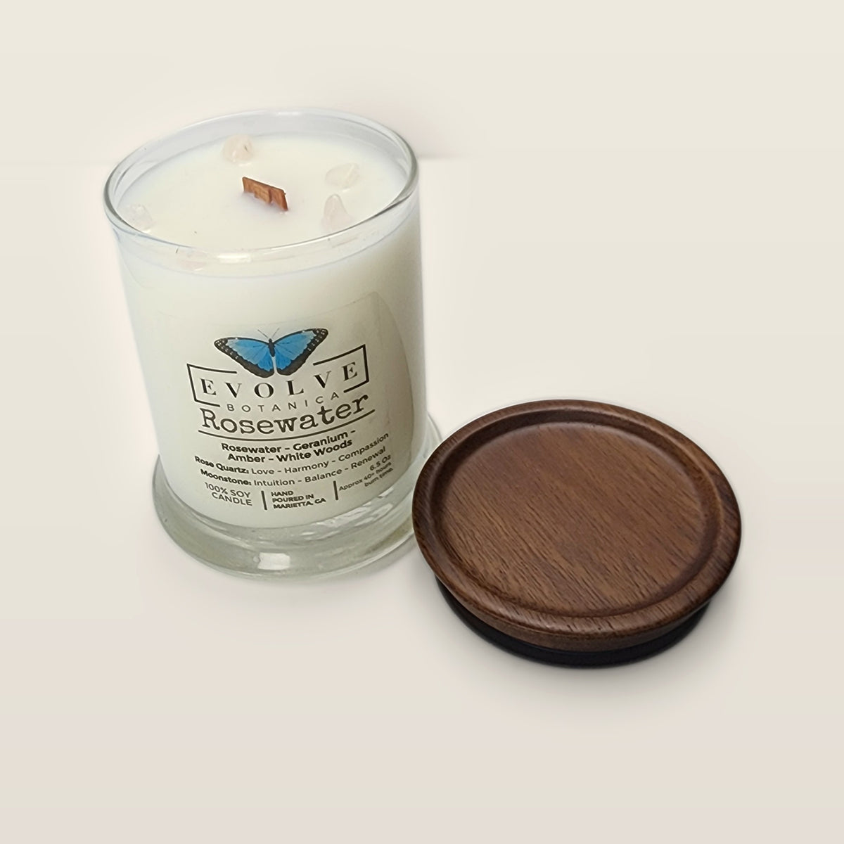 Evolve Botanica Rosewater 6.5 oz soy sipper candle open with wood lid and crystals