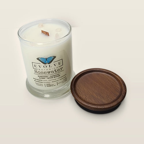 Evolve Botanica Rosewater 6.5 oz soy sipper candle open with wood lid and crystals