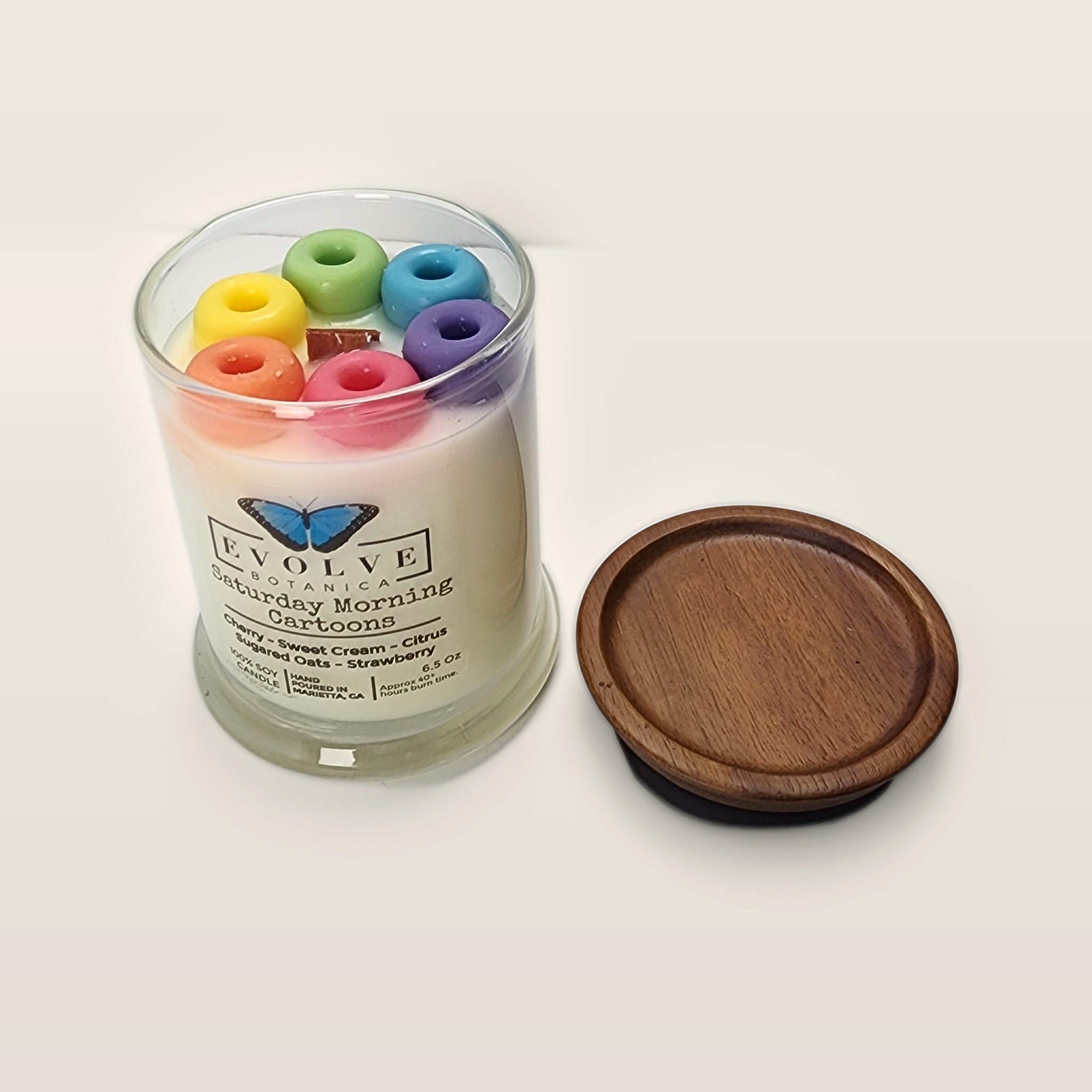 Evolve Botanica Saturday Morning Cartoons 6.5 oz soy sipper candle open with wood lid and crystals