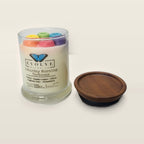Evolve Botanica Saturday Morning Cartoons 6.5 oz soy sipper candle angled view with wood wick and crystals