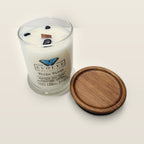 Evolve Botanica White Birch 6.5 oz soy sipper candle angled view with wood wick and crystals