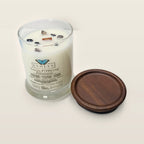 Evolve Botanica You're F#$King Fabulous 6.5 oz soy sipper candle angled view with wood wick and crystals