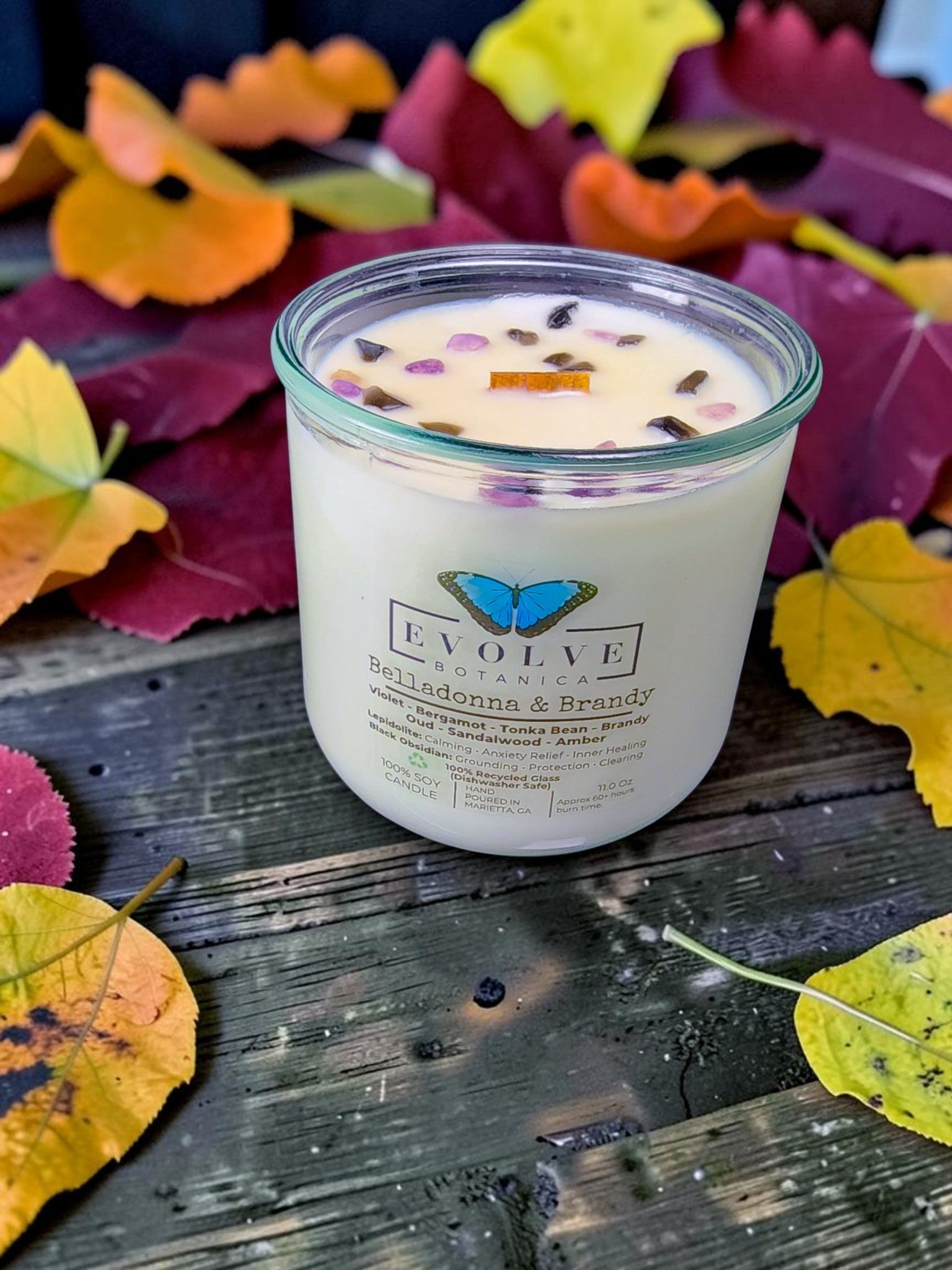 Apparition candle crystal detail on autumn leaves