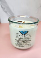 Strawberries & Champagne Rocks candle on pink and marble — white musk and sugar accord wood wick soy candle with golden healer quartz and rose quartz