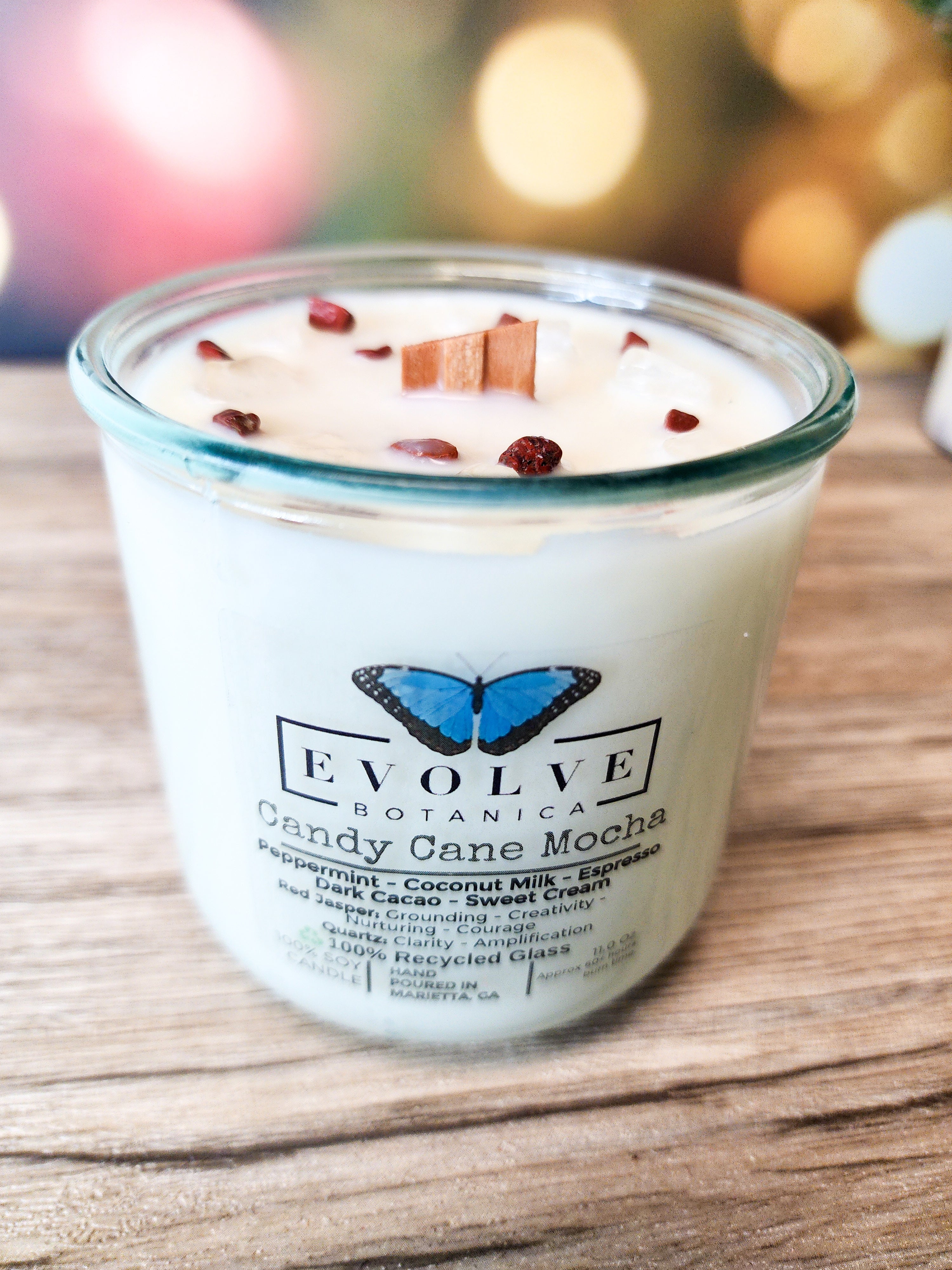 Evolve Botanica Candy Cane Mocha Rocks Candle — wood wick soy candle topped with Red Jasper and Quartz, scented with peppermint, espresso, dark cacao and sweet cream