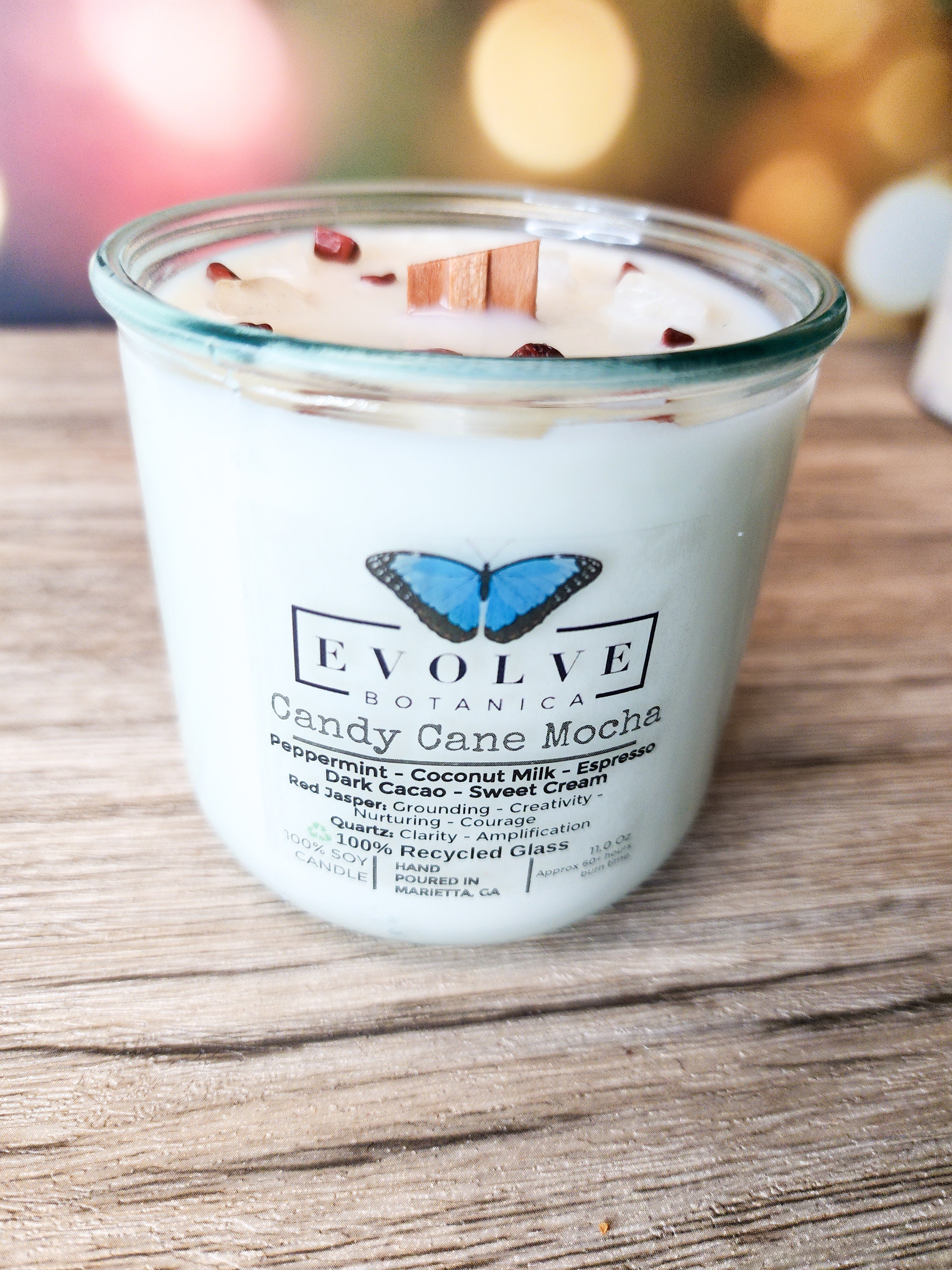 Evolve Botanica Candy Cane Mocha Rocks Candle — wood wick soy candle topped with Red Jasper and Quartz, scented with peppermint, espresso, dark cacao and sweet cream