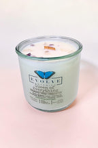 Queen of Everything wood wick soy candle lit — royal floral atmosphere