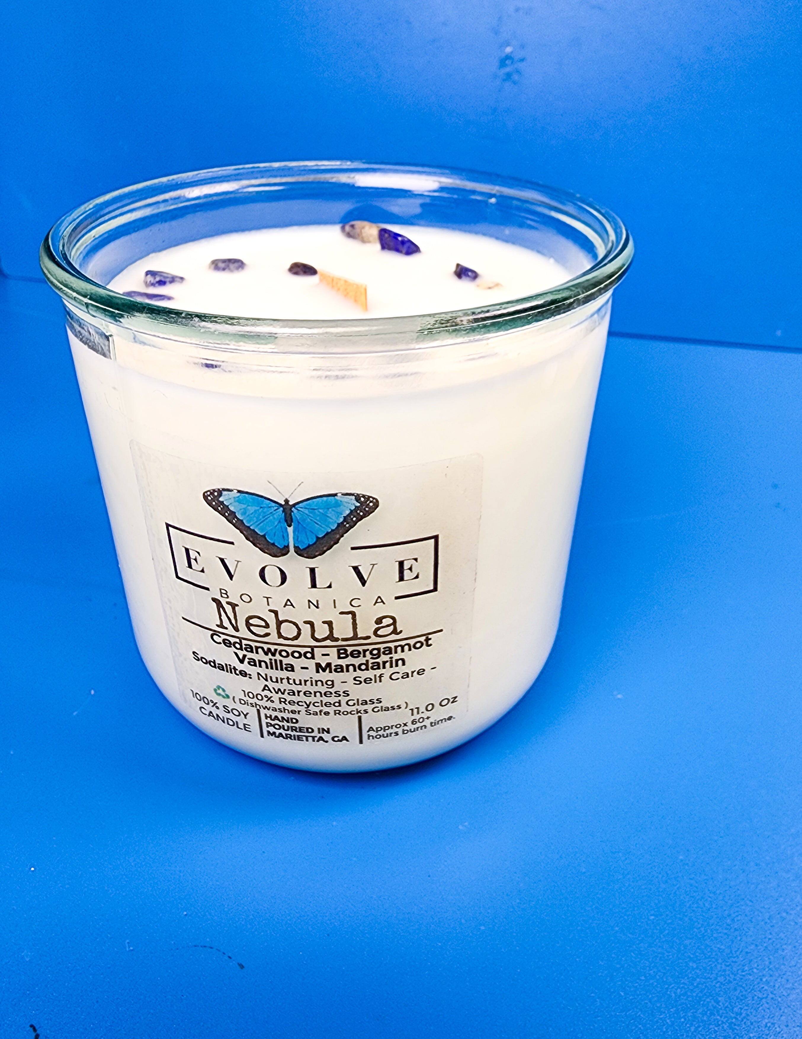Close-up of Sodalite crystal in Nebula candle — wisdom and insight stone