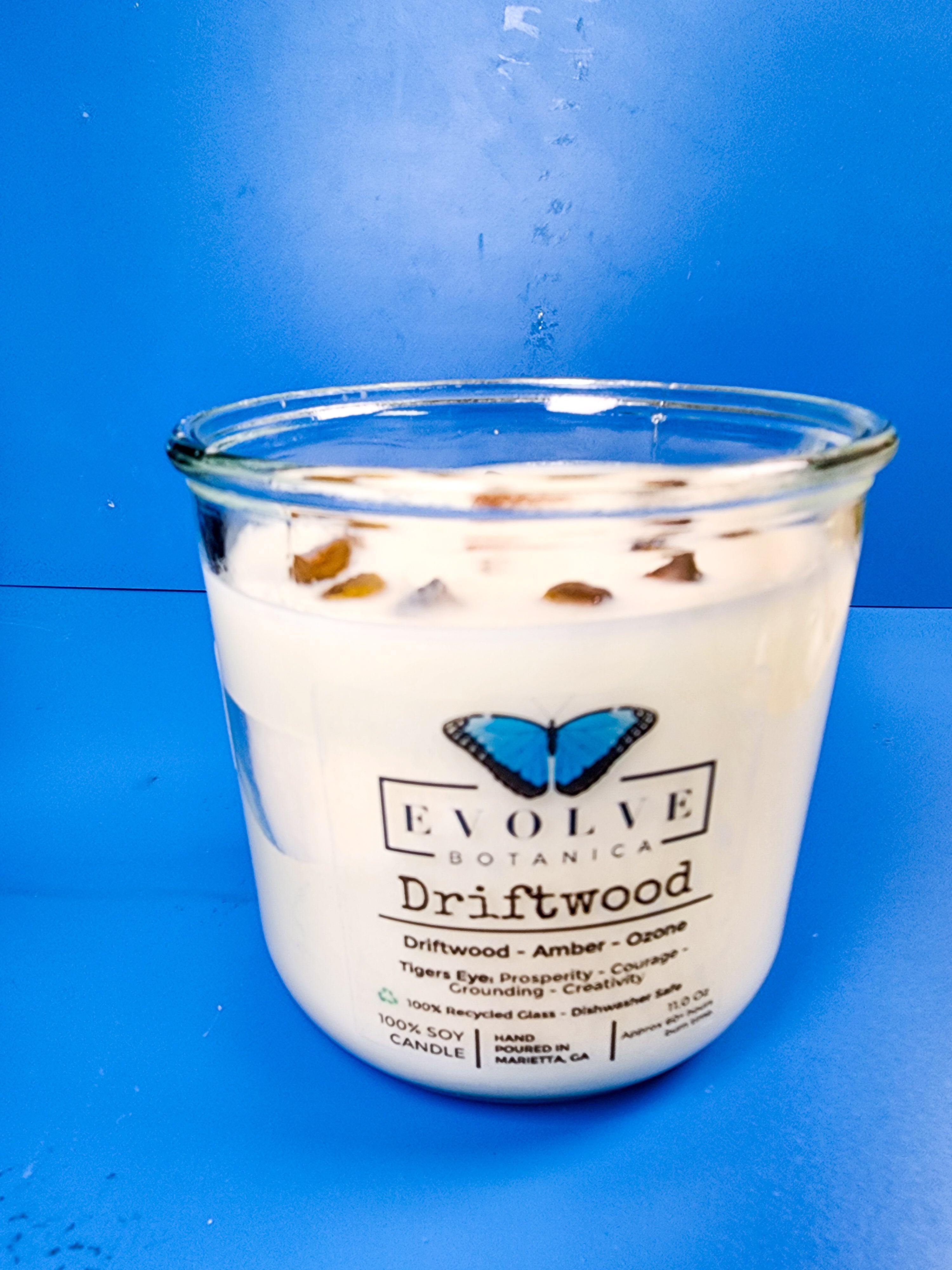 Driftwood candle from above showing soy wax and Tiger Eye crystal
