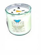 Spellbound Rocks candle styled with amber accents and crystals — witchy home decor