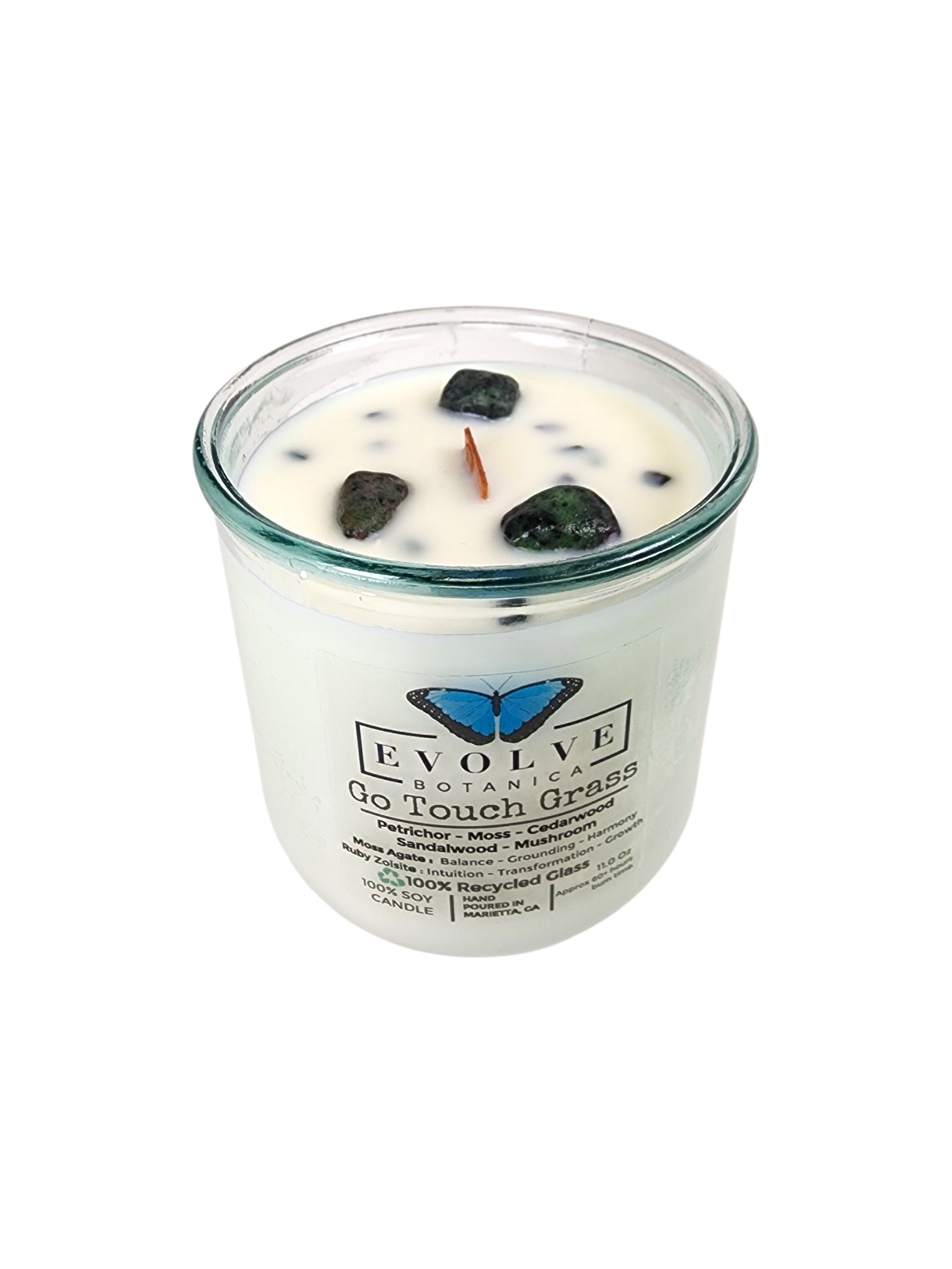 Evolve Botanica Go Touch Grass Rocks Candle — wood wick soy candle topped with Moss Agate and Ruby Zoisite, scented with petrichor, moss, cedarwood, sandalwood and mushroom