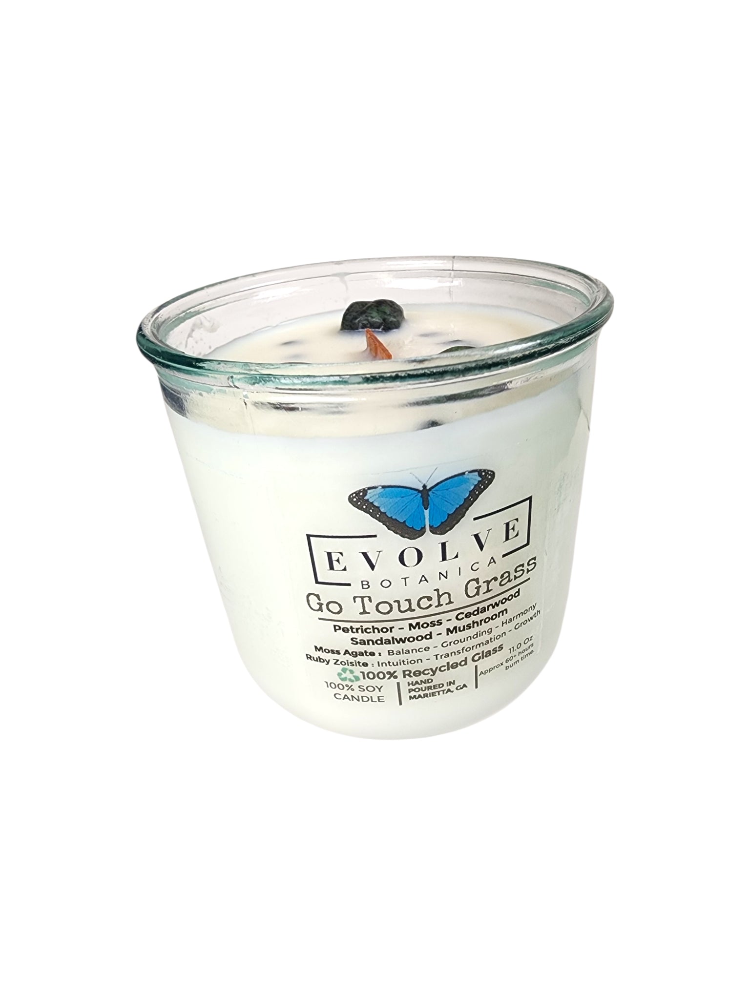 Evolve Botanica Go Touch Grass Rocks Candle — wood wick soy candle topped with Moss Agate and Ruby Zoisite, scented with petrichor, moss, cedarwood, sandalwood and mushroom