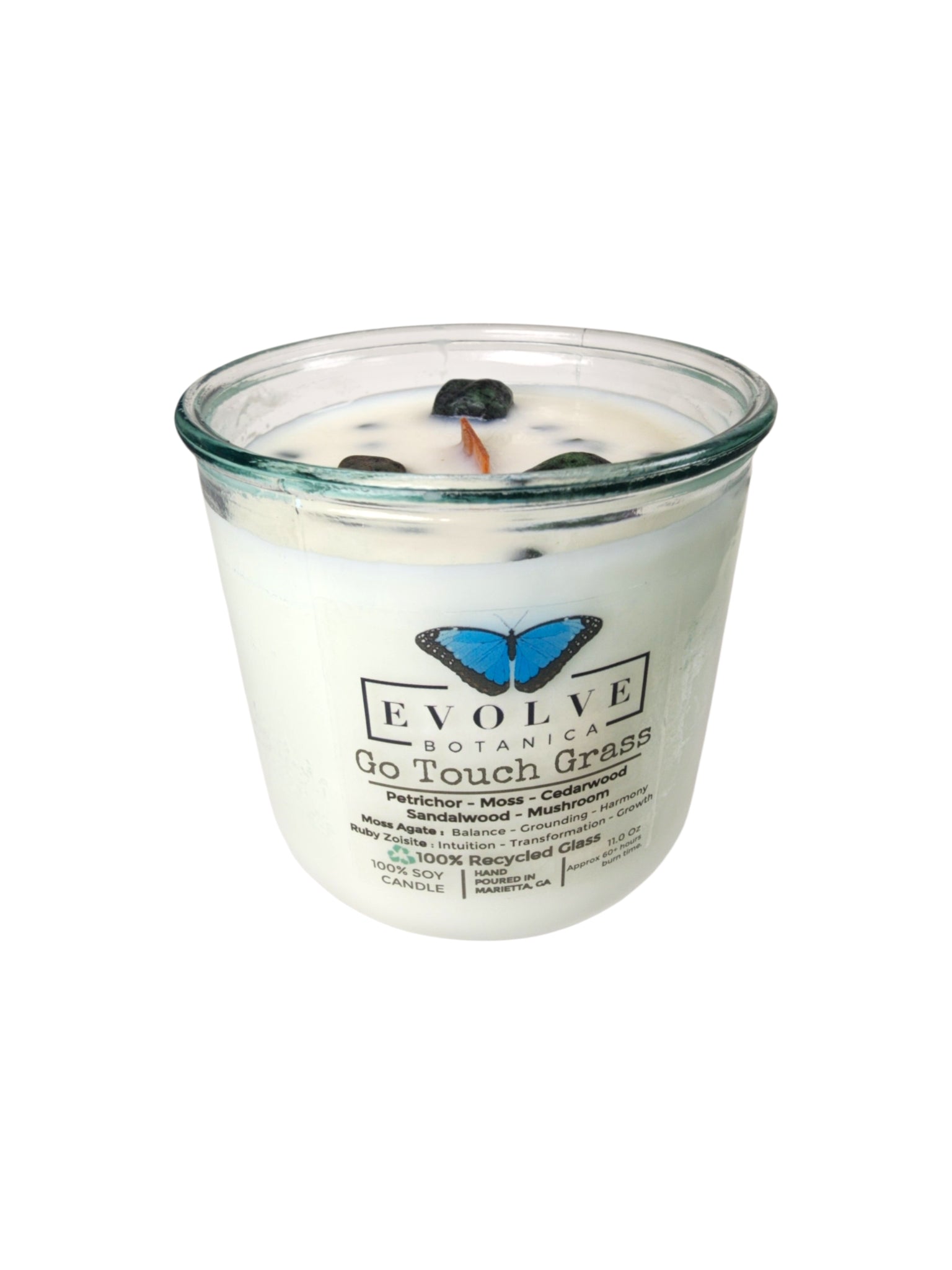 Evolve Botanica Go Touch Grass Rocks Candle — wood wick soy candle topped with Moss Agate and Ruby Zoisite, scented with petrichor, moss, cedarwood, sandalwood and mushroom