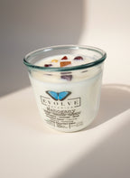 Evolve Botanica Mahogany Rocks Candle — wood wick soy candle topped with Mookaite Jasper, scented with amber, teakwood, mahogany, geranium, lavender and musk