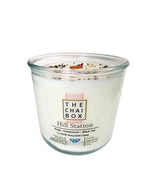 Evolve Botanica Hill Station Rocks Candle — wood wick soy candle topped with loose Hill Station chai (Chai Box × Evolve Botanica collab), scented with rose, cardamom and black tea