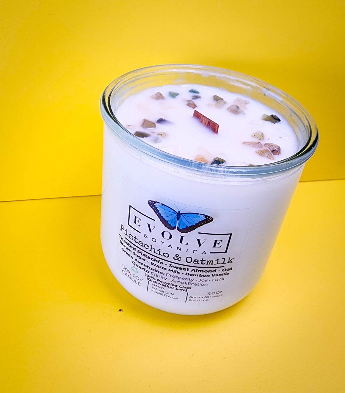 Pistachio and Oatmilk candle moody studio shot with crystals