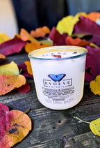 Pistachio and Oatmilk gemstone candle angled view on autumn leaves