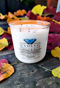 Saffron and Suede Rocks Candle - saffron peach sandalwood leather soy candle with Bronzite and Golden Healer Quartz on autumn leaves