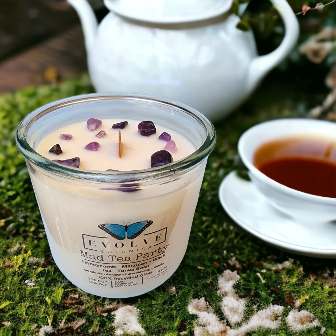 Mad Tea Party Rocks candle styled with tea accents — whimsical home decor