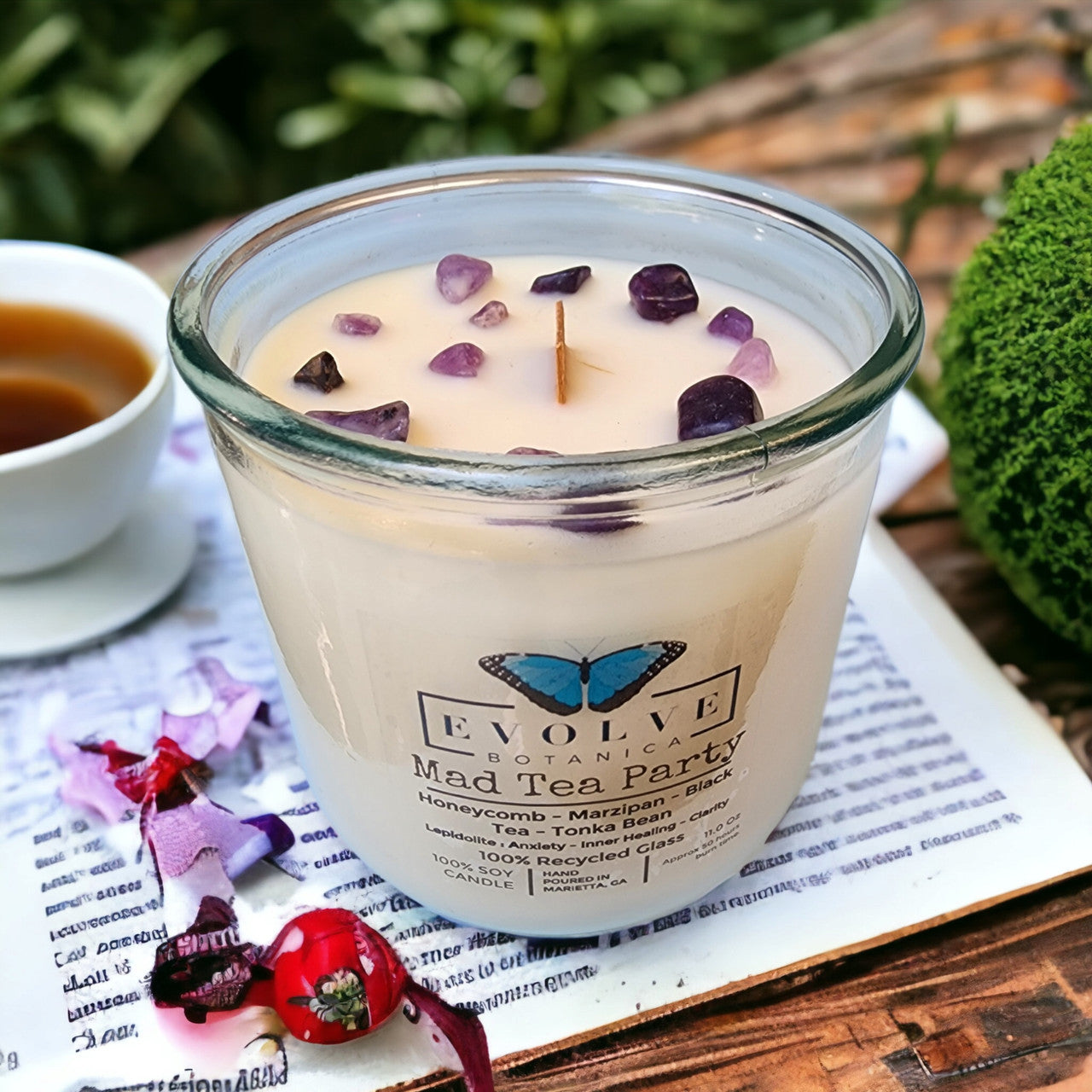 Mad Tea Party Rocks candle in Evolve Botanica packaging — Alice in Wonderland gift
