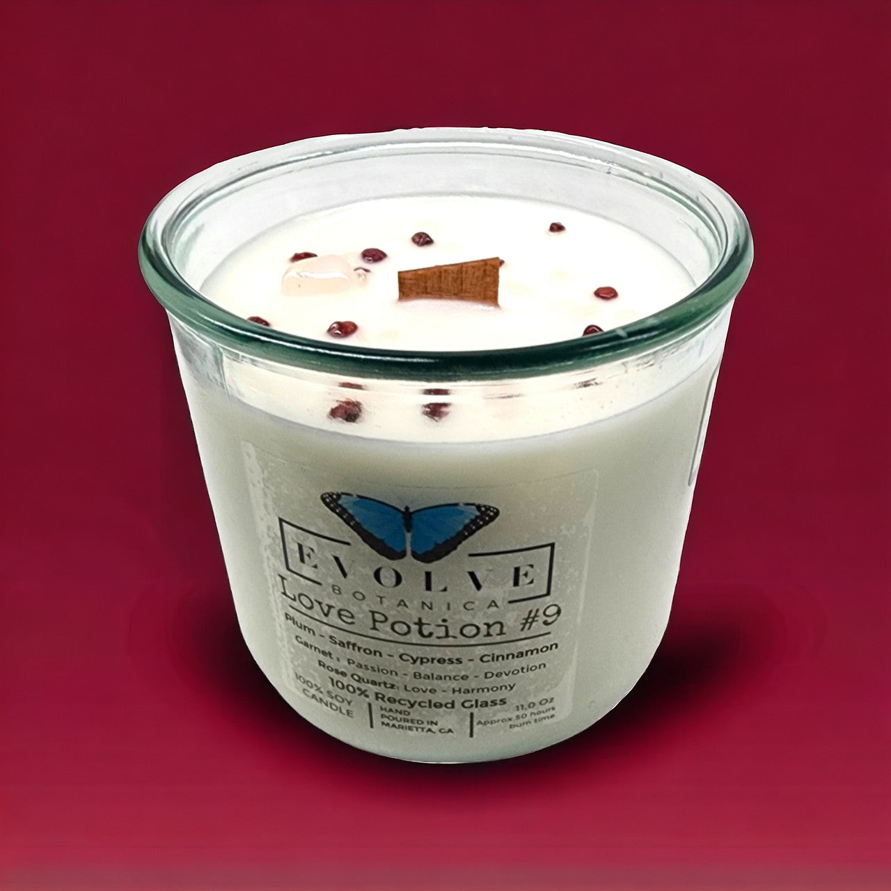 Love Potion #9 Rocks candle side view showing Garnet & Rose Quartz crystals