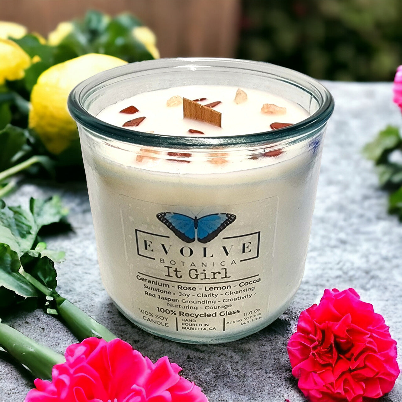 Close-up of Sunstone & Red Jasper in It Girl candle — confidence and self-love stones