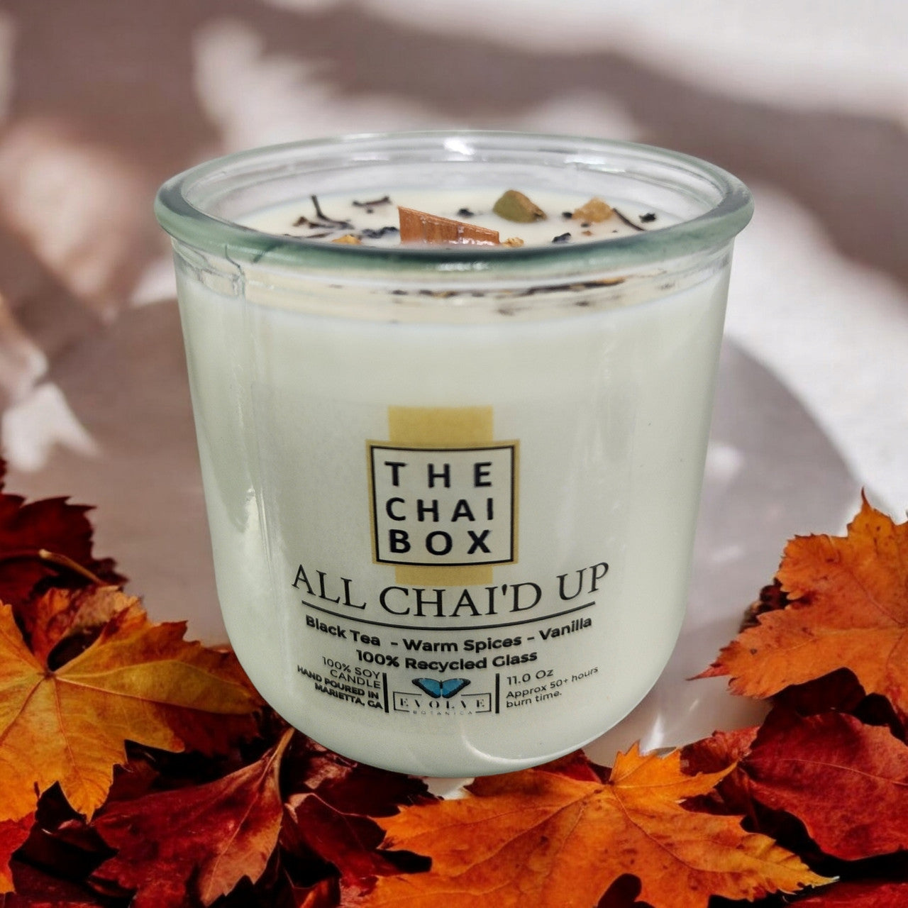 Evolve Botanica All Chai'd Up Rocks Candle — wood wick soy candle topped with loose All Chai'd Up chai (Chai Box × Evolve Botanica collab)
