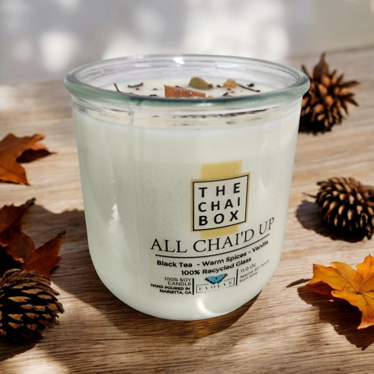 Evolve Botanica All Chai'd Up Rocks Candle — wood wick soy candle topped with loose All Chai'd Up chai (Chai Box × Evolve Botanica collab)