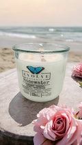 Rosewater wood wick soy candle lit — feminine floral atmosphere