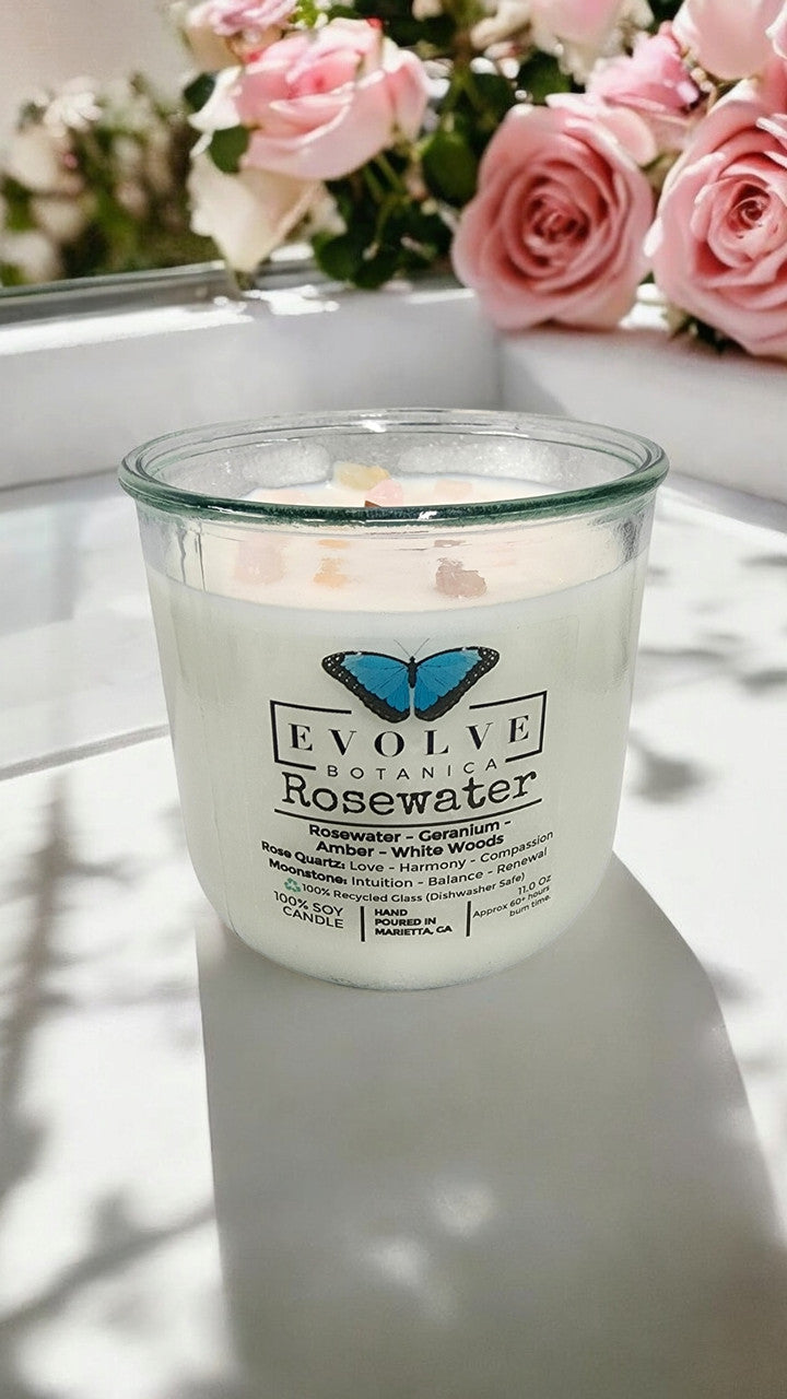 Rosewater Rocks candle styled with roses — romantic feminine home decor