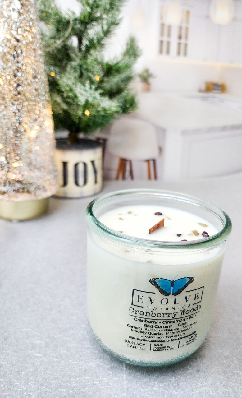 Cranberry Woods Rocks candle styled with cranberries — holiday home decor