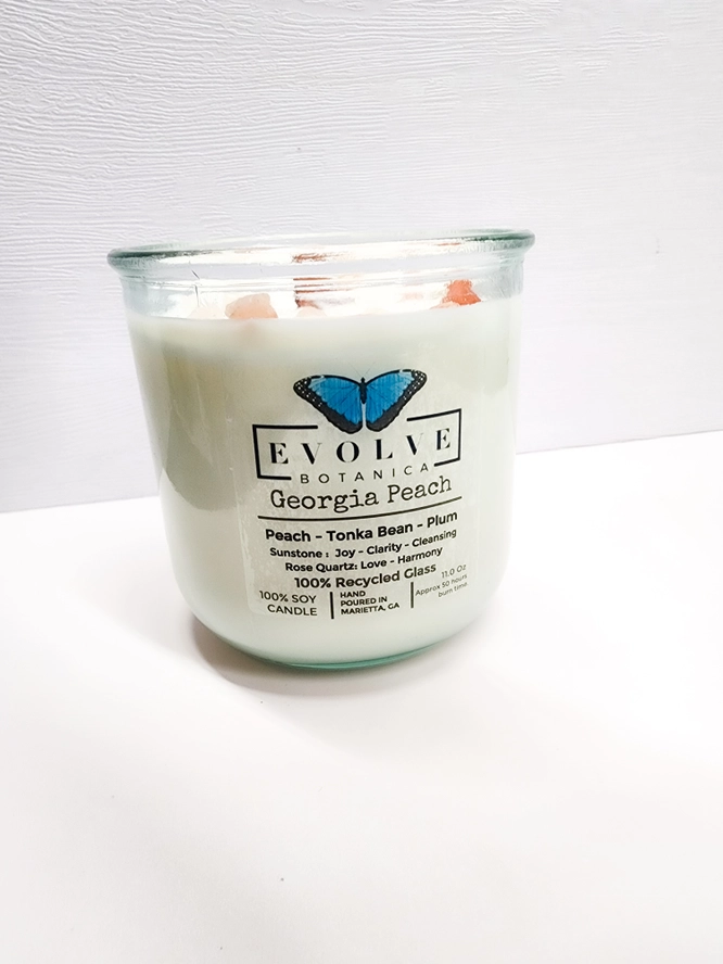 Georgia Peach Rocks candle styled with peach accents — southern hostess gift