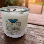 Evolve Botanica Bourbon Barrel Rocks Candle — wood wick soy candle topped with Tiger Eye, scented with bourbon, oak, smoke and tonka bean