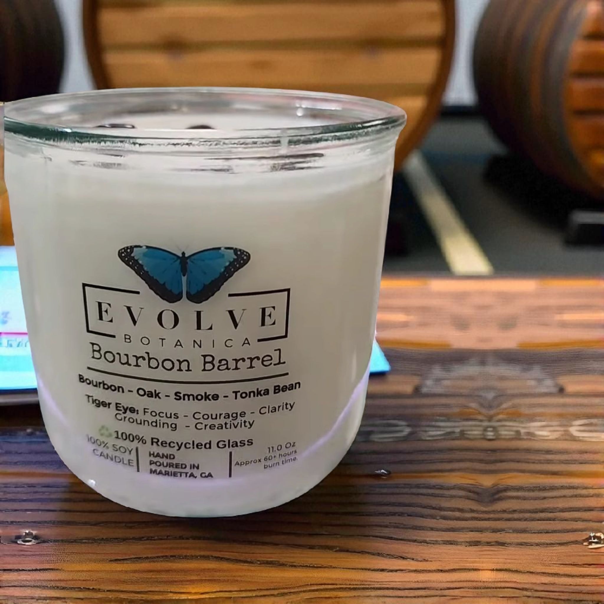 Evolve Botanica Bourbon Barrel Rocks Candle — wood wick soy candle topped with Tiger Eye, scented with bourbon, oak, smoke and tonka bean
